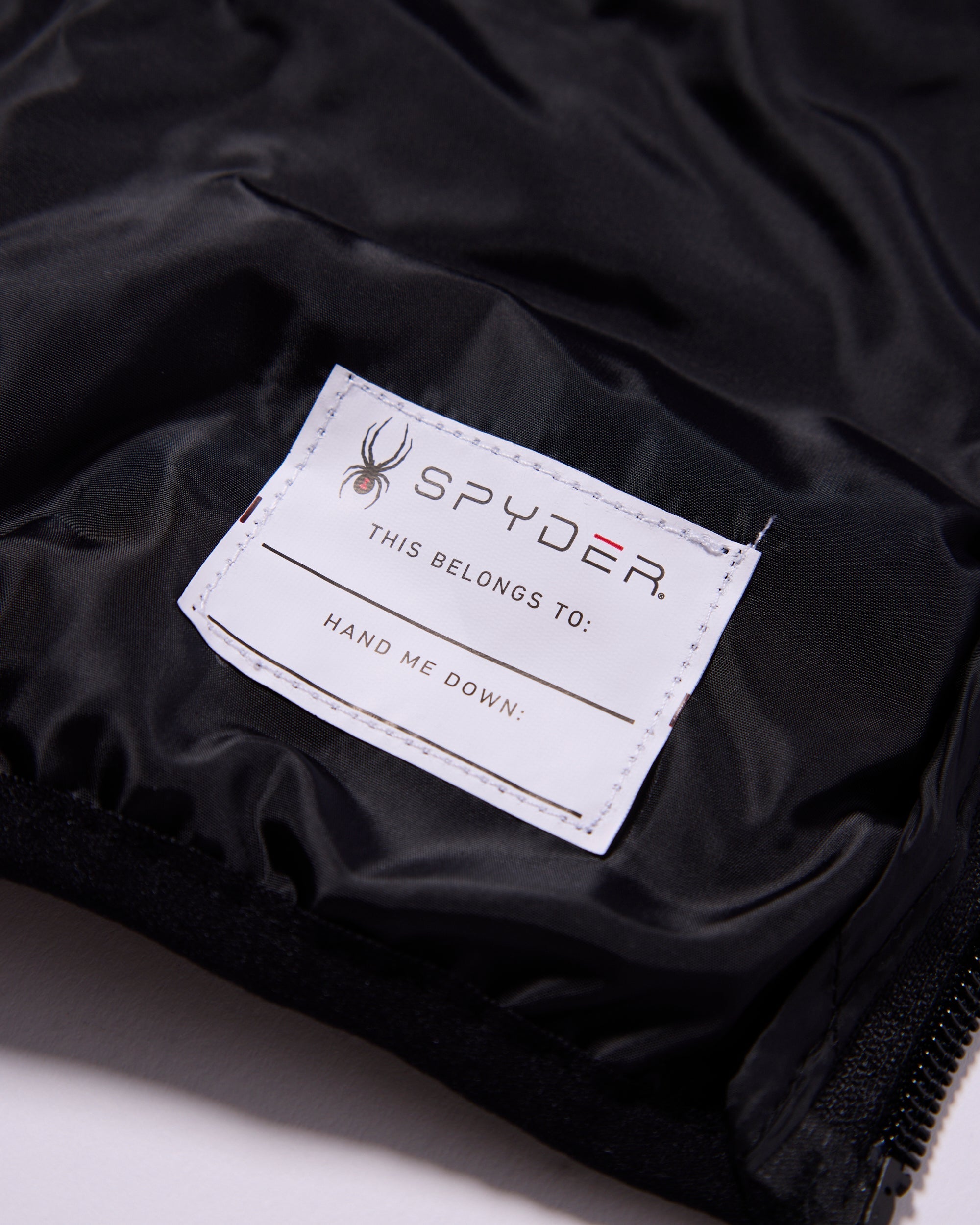 Spyder label on a black jacket