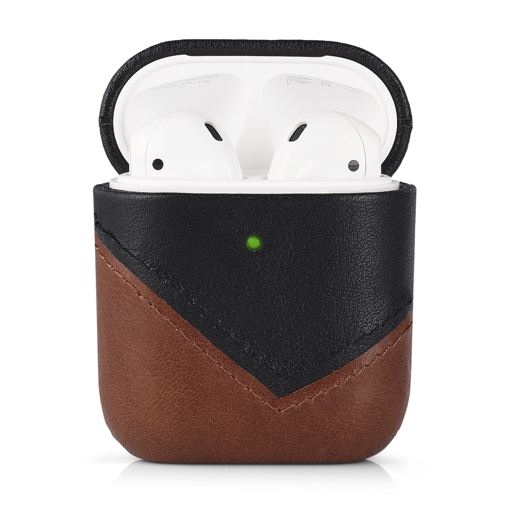 Two-tone brown and black leather AirPods case (TERRA), open showing white AirPods and green LED — FCC visible inside lid